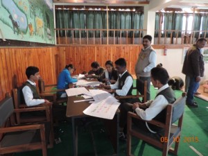 Children engaged in slogan writing and painting competition during Wildlife week celebrations at GHNP, 2015